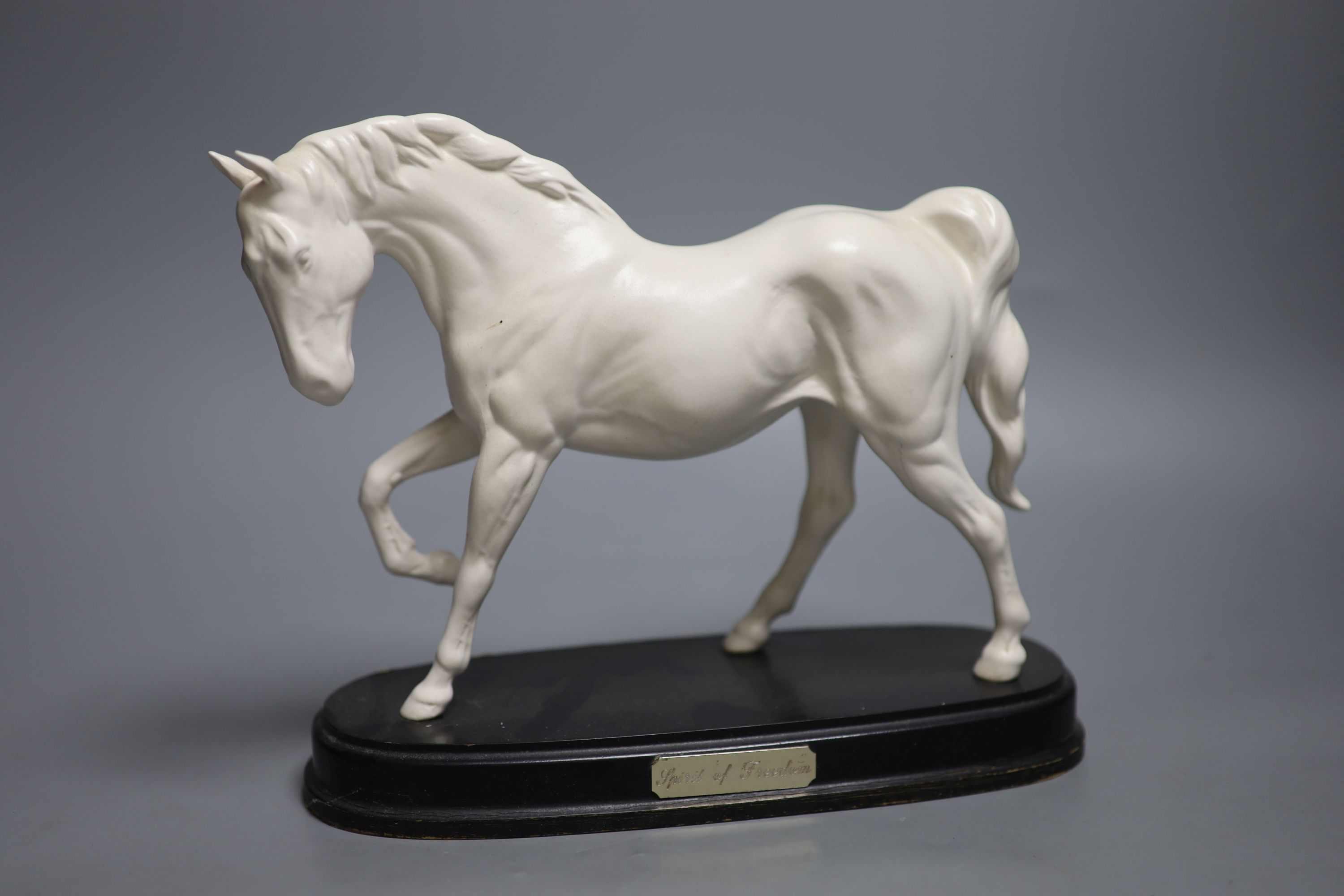 A Doulton silicon Lambeth planter, A Royal Doulton ‘Spirit of Freedom’ horse and a figural porcelain casket